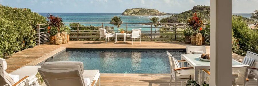Ocean-view pool terrace at Rosewood Le Guanahani Saint Barth overlooking Grand Cul-de-Sac.