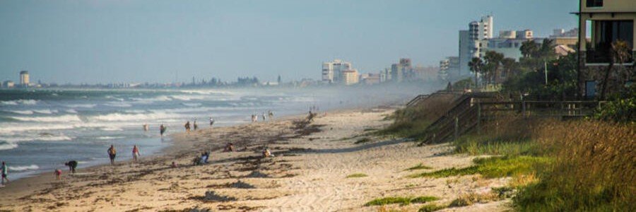 Wide sandy shoreline and Atlantic Ocean views along Satellite Beach on Florida's Space Coast.