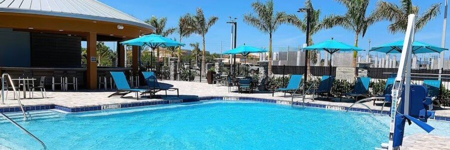 Outdoor pool and patio area at SpringHill Suites by Marriott Cape Canaveral.