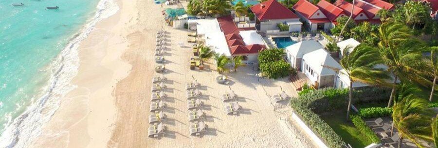 Aerial view of St. Jean Beach with white sand and beachfront resorts in St. Barts.