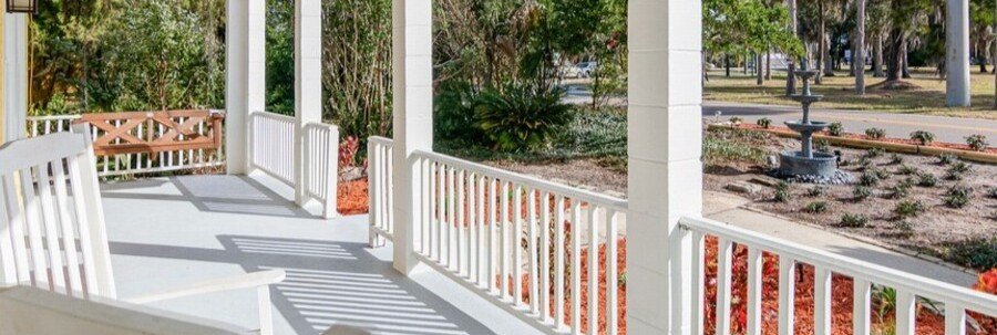 Front porch with rocking chairs at The Wayward Traveler's Inn in Titusville