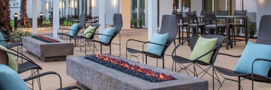 Outdoor patio with fire pits at Courtyard by Marriott Titusville Kennedy Space Center.