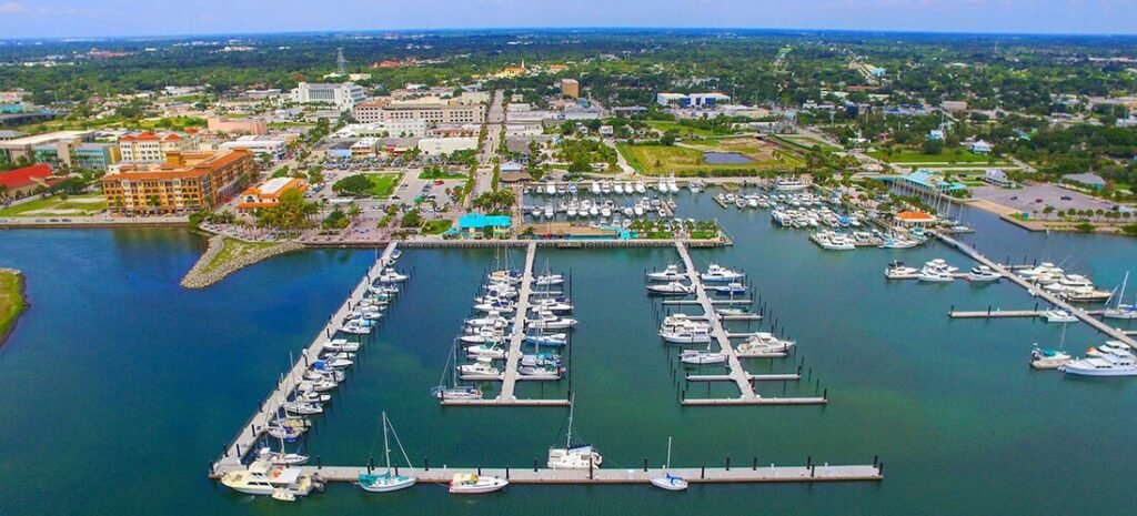 Fort Pierce City Marina and Downtown Waterfront | Beach Travel Destinations Aerial view of boats and floating docks at Fort Pierce City Marina beside the downtown waterfront
