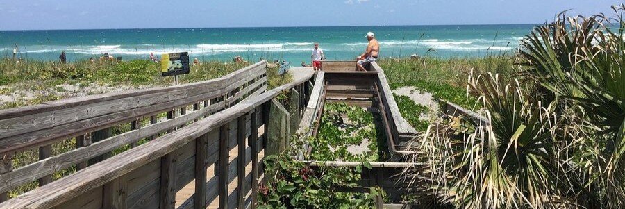 Wooden beach boardwalk leading to Hobe Sound Beach on Florida's Atlantic coast.
