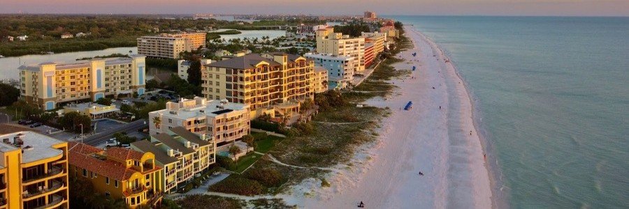 Aerial view of beachfront hotels and the Atlantic coastline in Indian River Shores, Florida.