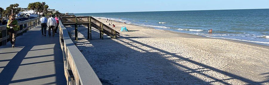 Beach boardwalk and sandy shoreline at Jaycee Beach Park in Indian River Shores, Florida.