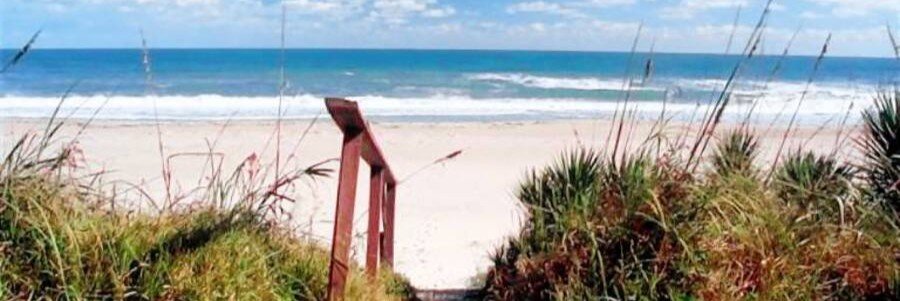 Boardwalk leading through sea oats to Melbourne Beach on Florida's Space Coast.