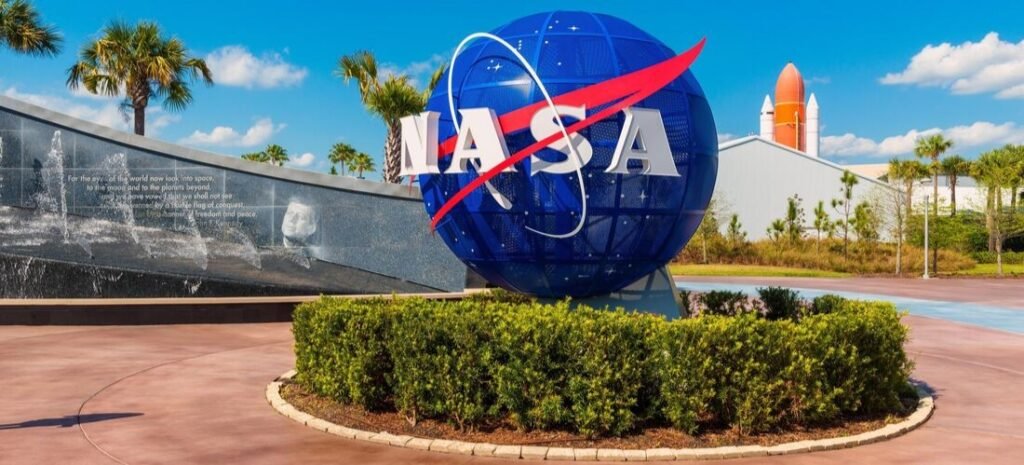 NASA Globe at Kennedy Space Center | Beach Travel Destinations The iconic blue NASA logo globe at the entrance of the Kennedy Space Center Visitor Complex on Merritt Island.