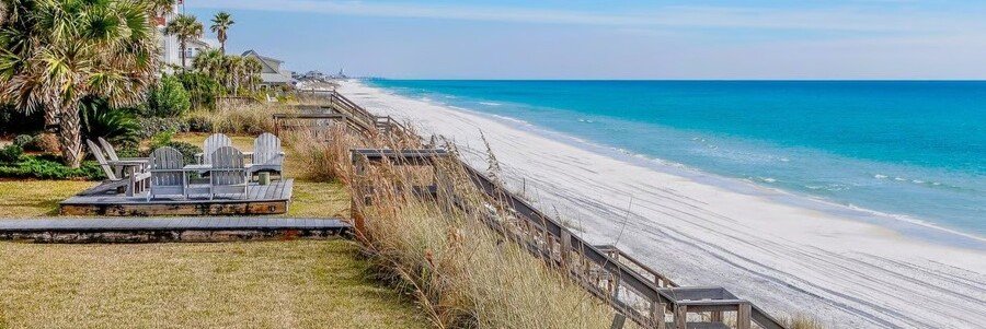 Oceanfront homes overlooking the white sand beach in Orchid, Florida.