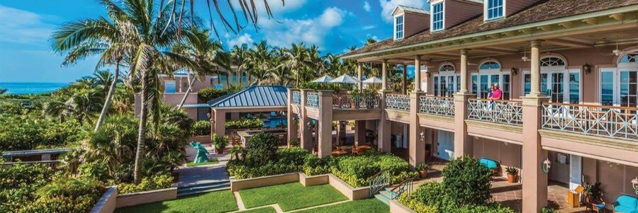 Luxury homes and clubhouse at Orchid Island Golf Community in Orchid, Florida.