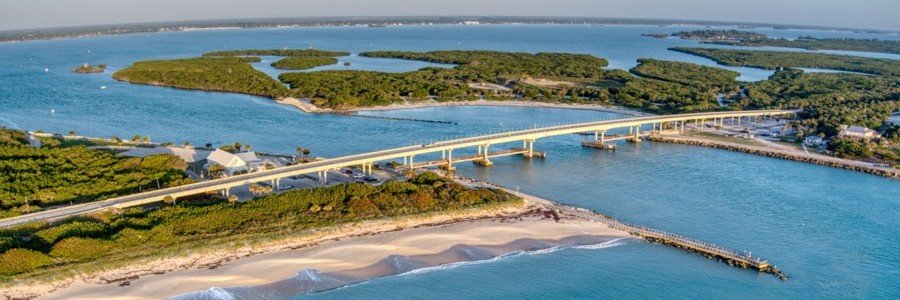 Aerial view of Sebastian Inlet State Park with the bridge, beaches, and waterways in Florida.