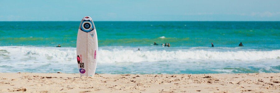 Surfboard standing on the beach at Sebastian Inlet, a popular surfing destination in Florida.