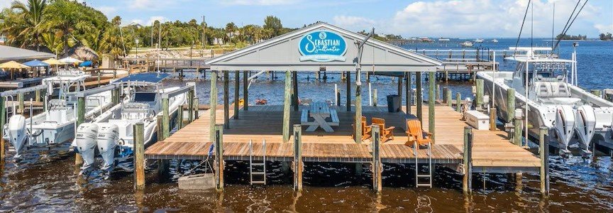 Boats docked at Sebastian Saltwater Marina and Lodge overlooking the Indian River Lagoon.