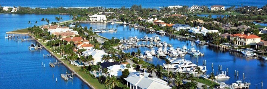 Aerial view of the Stuart waterfront marina with boats and the St. Lucie River in Stuart, Florida.