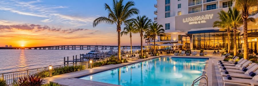 Luminary Hotel & Co. overlooking the Caloosahatchee River at sunset in Fort Myers