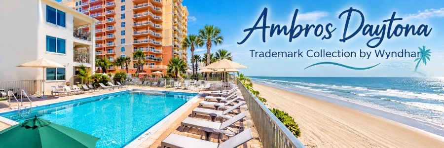 Oceanfront swimming pool, lounge chairs, and sandy beach at Ambros Daytona
