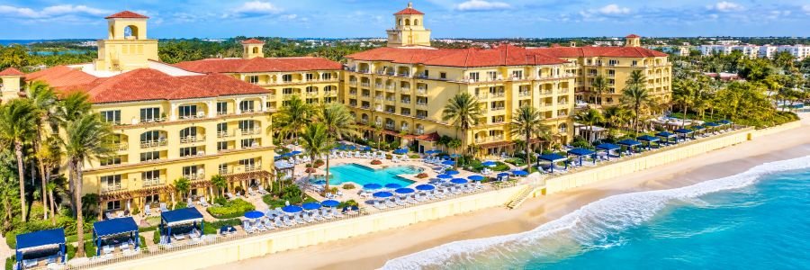 Eau Resort & Spa in Manalapan Florida with oceanfront pool, palm trees and private beach