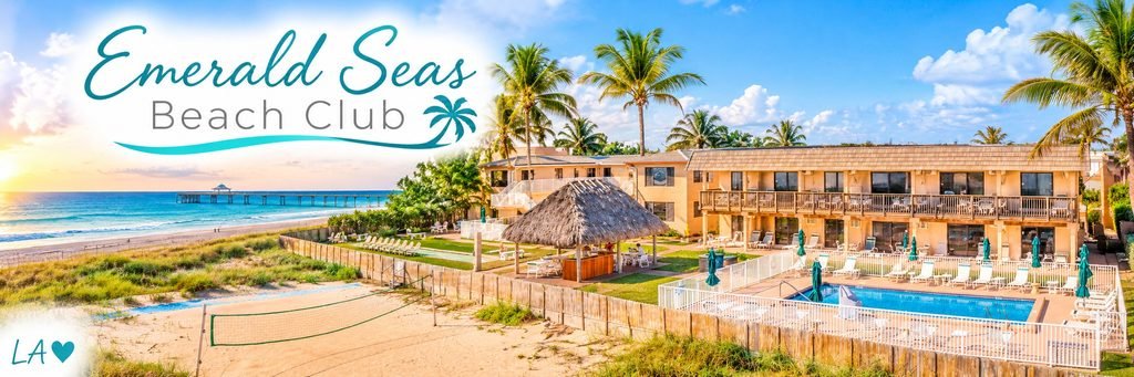 Emerald Seas Beach Club with a beachfront swimming pool, thatched tiki hut, palm trees, sandy volleyball court, and ocean pier in the distance.
