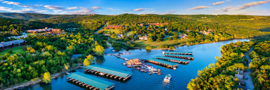 Aerial view of Table Rock Lake near Branson with marina docks, boats, forested Ozark hills, and waterfront resorts