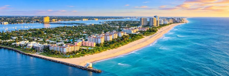 Aerial view of Singer Island and Riviera Beach with turquoise Atlantic waters, sandy beaches, and oceanfront resorts.