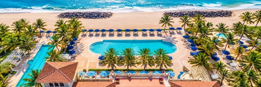 The Breakers Palm Beach with oceanfront pool, palm trees and Atlantic Ocean